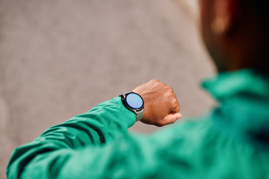 Black Man Checking Smartwatch 