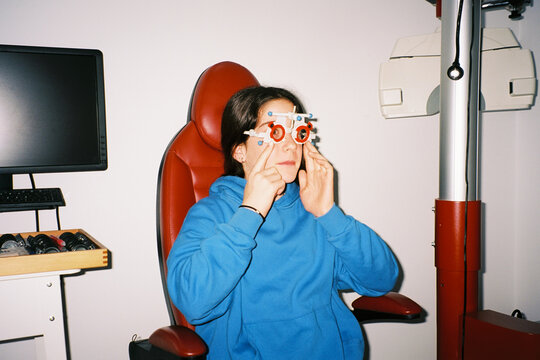 Girl adjusting trial frame