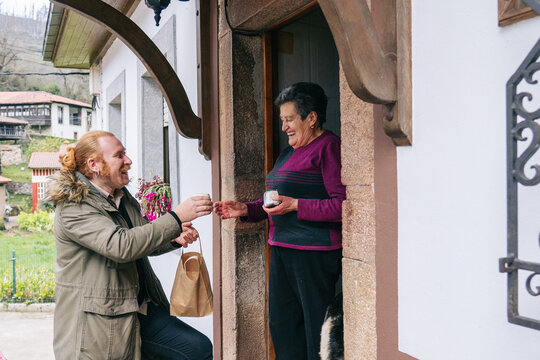 Local cheesemaker delivering products to senior customer
