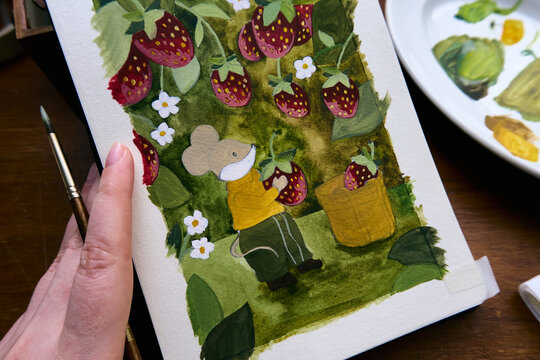 Woman showing her illustration