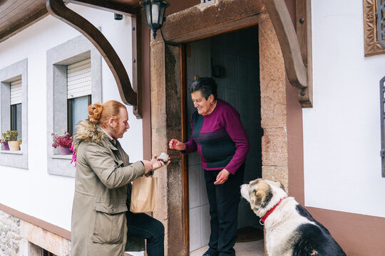 Artisan cheesemaker delivering local products to customer