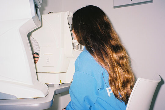 Girl taking eye test