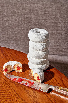 Powder-sugar Jelly Donuts Sliced in Half