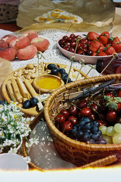 Film Photo of Summer Fruit and Cheese Spread on Lace Tablecloth