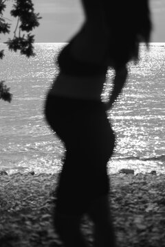 Soft Focus Silhouette of Pregnant Woman by the Sea