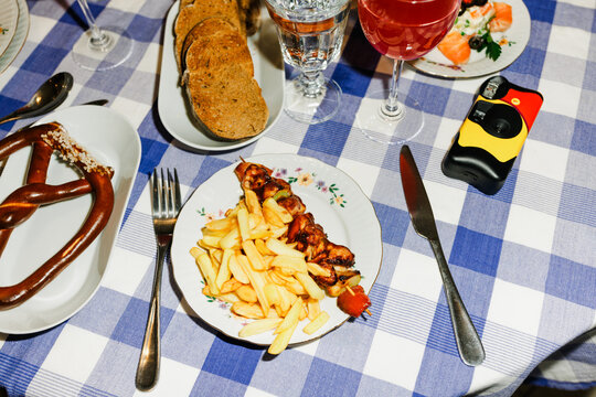 Table Setting With Food and Drinks at a Casual Dinner