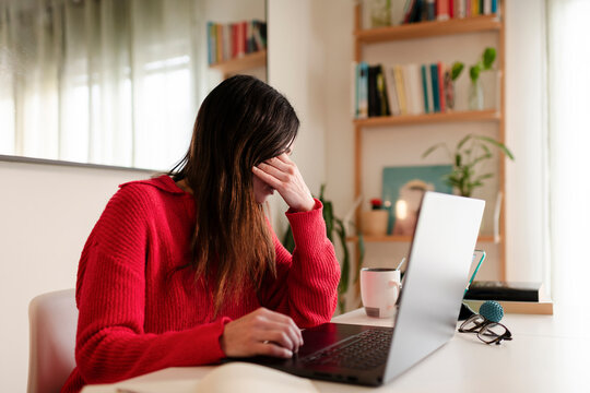 Stressed Woman teleworking at home