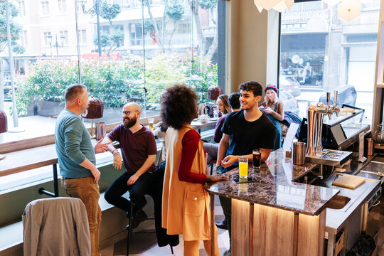 Friends social gathering at a modern bar restaurant