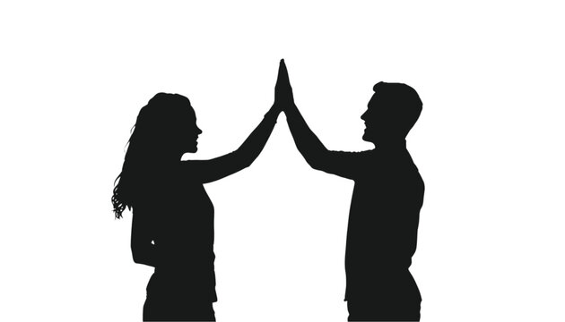 Couple stands in silhouette while performing a high five to celebrate their successful collaboration.