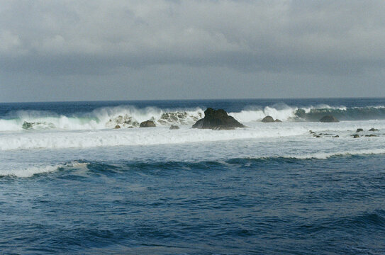 Large waves hitting black volcanic beach in Tenerife