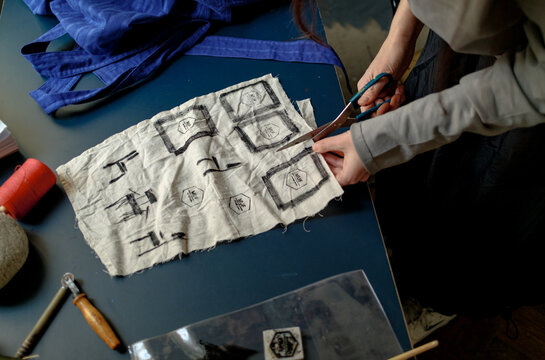 The designer creates labels for his clothes