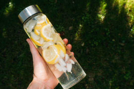Lemon Slices in Reusable Glass Water Bottle