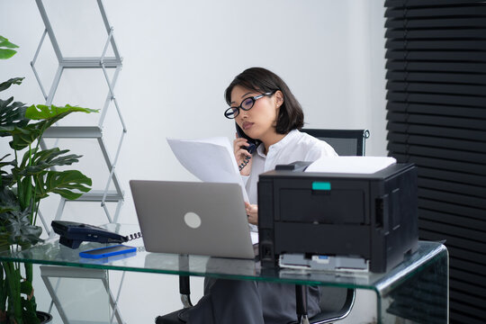 Asian business woman at office.
