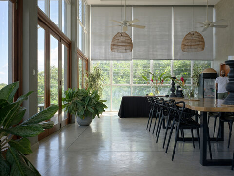 Luxury Boutique Hotel Dining Area With Large Windows and Plants