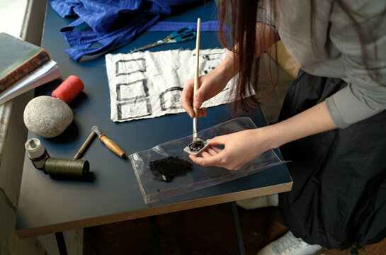 The designer creates labels for his clothes