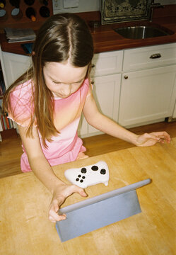 Young Girl Portrait gaming controller computer tablet