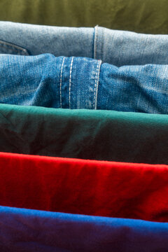 Colorful folded clothes with denim texture layers