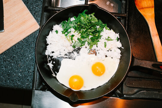 Healthy Egg and Rice Breakfast Cooking in pan