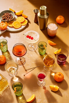 Table Scene of Warm Cocktails and Bottles in Sunny Light