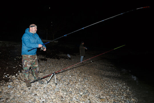 Anglers are fishing at night