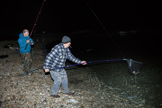 Friends catch blue crabs at night