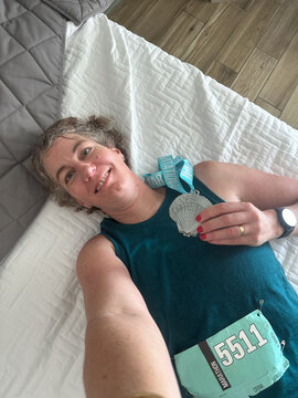 UGC of proud and exhausted middle aged marathoner