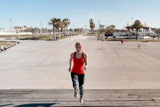 Focused Runner Training On Urban Waterfront