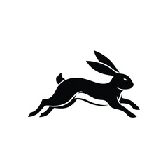 Black silhouette of a rabbit leaping forward with long ears © dipu