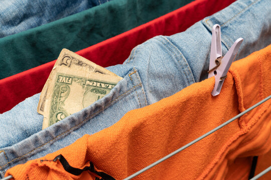 Money hidden in denim pocket on drying clothes
