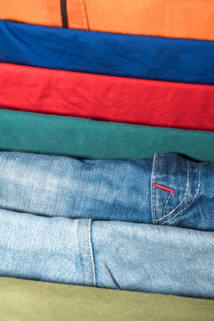Stacked colorful clothing with denim detail
