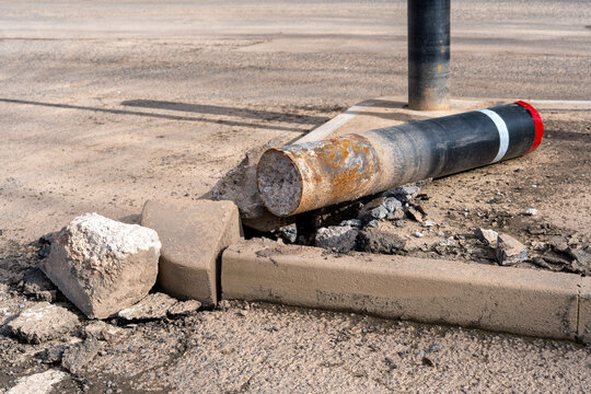 Damaged traffic bollard on the ground