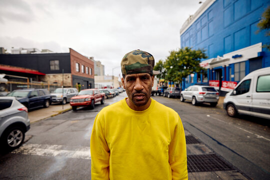 Casual man stands in the middle of the street in Brooklyn