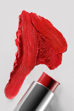Red Lipstick and its Swatch on White Background in Close Up