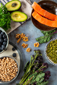 Healthy produce including chickpeas, salmon and avocado. 