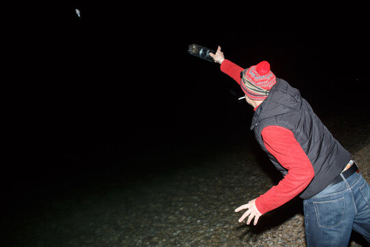 Fisherman uses a homemade fishing tackle  at night