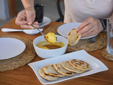 Eating Sri Lankan Breakfast With Egg Curry and Flatbreads