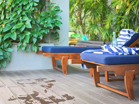 Relaxing Poolside Space With Lounge Chairs and Plants