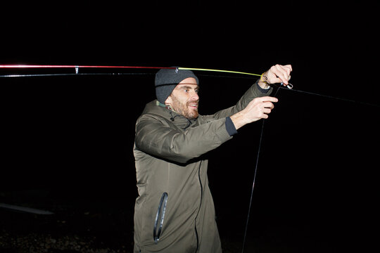 Angler on a night fishing trip