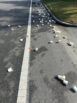 UGC view of cups thrown on ground during a road race after aid station