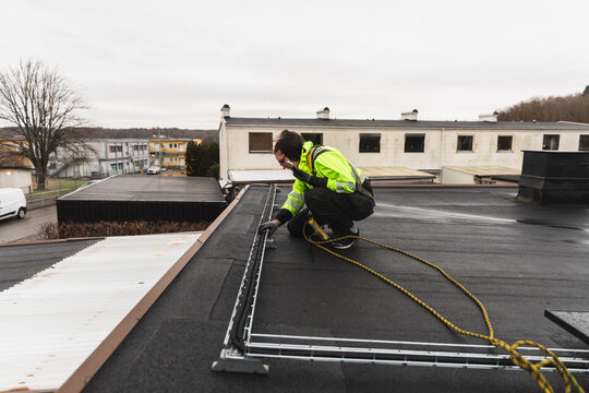 Technician Checking Solar Panel Pipe Infrastructure