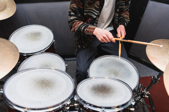 Close-Up Perspective of Drummer Hitting Snare During Studio Session