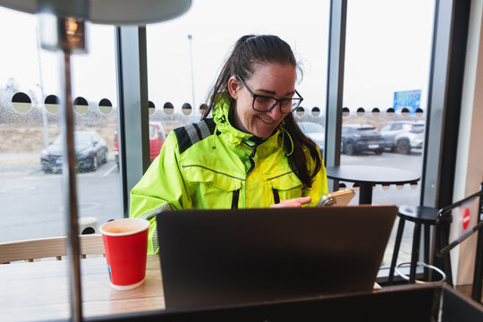 Female Technician Working on Laptop During Break