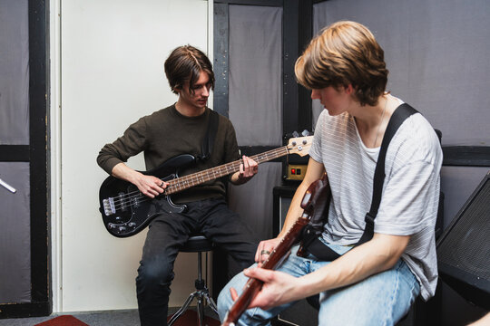 Musicians Collaborating on Songwriting During Rehearsal