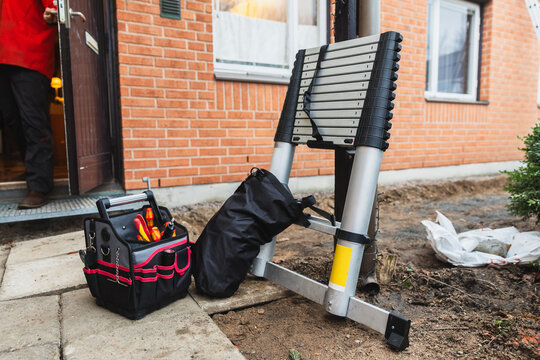 Tools and Telescopic Ladder at Residential Renovation Site