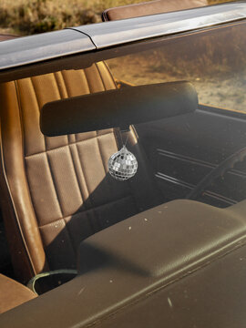Disco Ball Hanging from Rearview Mirror