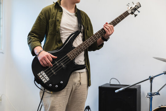 Close-up of musician playing black bass