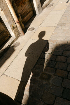 UGC shadow on cobblestone in Lyon France 