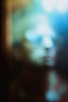 Blurry Figure Behind Glass