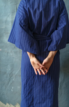 a woman's hands behind her back