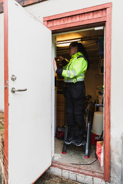 Technician Entering Building for Electrical Service